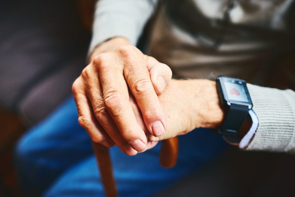 seniors resident holding a cane