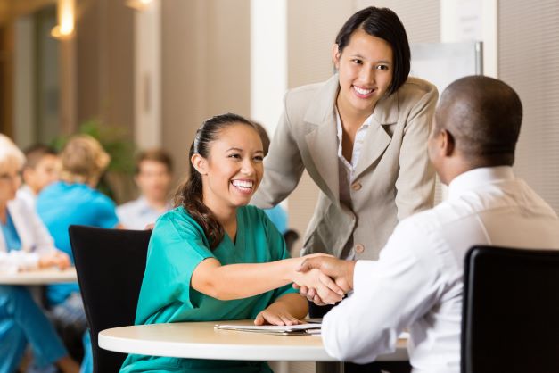 frontline care employee congratulated by her manager